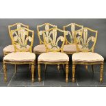 * Chairs. A set of six Edwardian Hepplewhite-style dining chairs, the painted shield back with