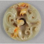 * Jade. Bi disk, decorated with qilong and phoenix, late Qing dynasty, early 20th century, carved