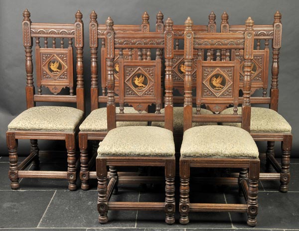 * Chairs. A good set of late Victorian oak chairs by Gillows of Lancaster, heavily carved in the