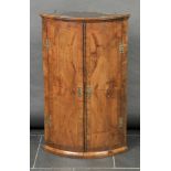 * Cabinet. A good George III mahogany bow-front corner cabinet, the quarter-veneered door with