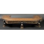 * Bench. An early 20th-century Burmese hardwood seat, of canted form, elaborately carved with