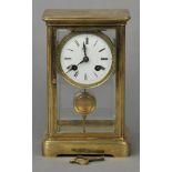 * Regimental Clock. An Edwardian brass cased mantle clock, the top inscribed ‘Presented by Corpls