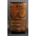 * Cabinet on stand. A George II style bowfront mahogany cabinet, the top with dentil moulded