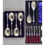 * Spoons. A cased set of four Victorian electroplated Apostle serving spoons, each with shell bowl