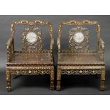 * Chinese chairs. A pair of 20th-century Chinese hardwood chairs, each with circular white marble