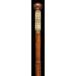 * Walking stick. A large Basque makila stick, with bone grip geometrically decorated with black