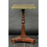 * Table. A Regency rosewood occasional table, the square tilt top tooled leather inset with brass