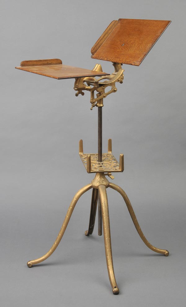 Book stand. A late 19th-century American encyclopaedia stand,  with an elaborate cast iron base