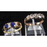 *Ring. A Georgian yellow metal and five stone diamond ring, the old cut stones aligned in lyre