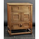 *Arts & Crafts. An oak cabinet, circa 1930s,  the rectangular top with hinged section, slide-out