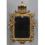 *Mirror. A good George III gilt wood wall mirror probably Victorian,  carved with a pagoda, exotic