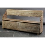 *Settle. An 18th-century style oak settle, the back carved with Latin motto and dated 1788, with