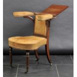*Chair. A William IV mahogany library/cock fighting chair,  upholstered in leather with padded arms,