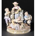 *Meissen. An impressive porcelain figure group,  modelled as a girl in the centre with a goat,