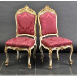 *Chairs. A pair of 19th-century Louis XV-style fauteuils,  each painted white with gilt-painted