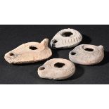 *Roman Pottery. A collection of four Roman teracotta lamps, various dates, 2nd to 4th century,