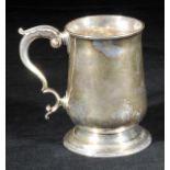 *Mug. A George III silver mug by John King, London 1777,  of baluster form with scroll handle, later