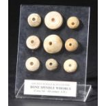 *Roman Bone. A group of nine Roman and Byzantine turned bone spindle whorls, various dates, 3rd to