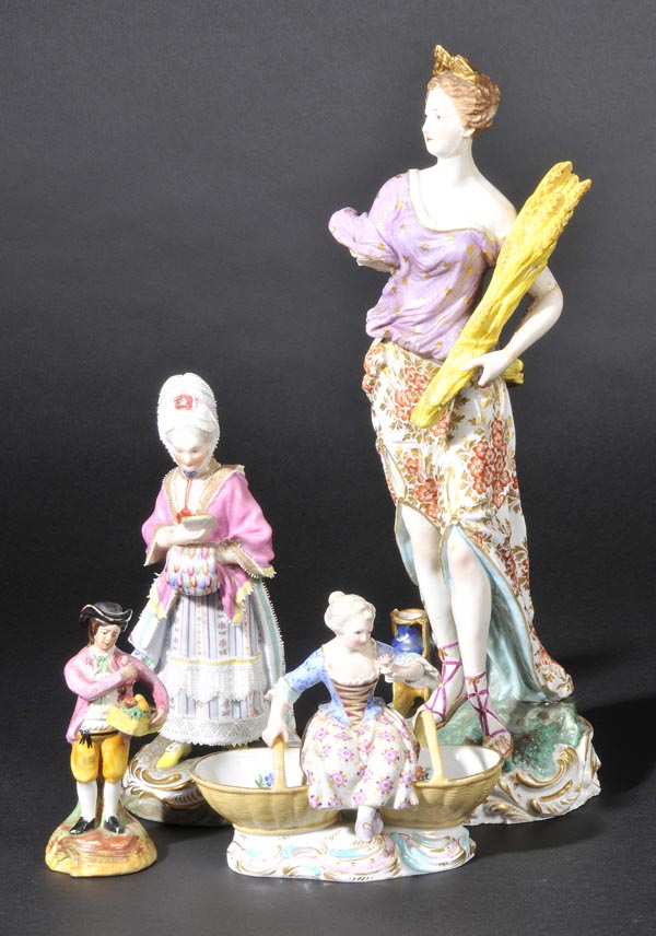 *Meissen. A late 19th-century Meissen porcelain sweetmeat dish,  modelled as a maiden in 18th-