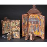 *Ephiopia. A collection of four carved wood religious icons,  including a hand-painted late 20th-