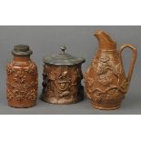 *Salt-glaze. Three salt-glaze stoneware pieces,  including a tobacco jar with moulded oak leaf