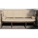 *Sofa. A Regency mahogany framed sofa,  with striped upholstery, reeded scroll arms on circular