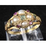 *Ring. A Victorian yellow metal cluster ring, set with seed pearls, ruby and emeralds,  inner