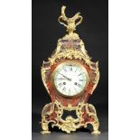 *Clock. An Victorian Boulle inlaid tortoiseshell mantel clock by Goldsmith Company, Regent Street