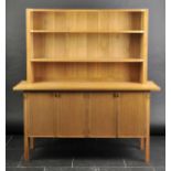 *Carter (Ronald). A 1980s light oak "Whitney" dresser designed for David Miles Furniture Ltd,  the