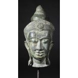 *Thai Bronze. A Thai bronze head of the Buddha embodying the guardian of the gates, Ayutthaya