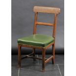 *Pugin. A Victorian oak chair in the manner of A.W.N. Pugin,  the curved top rail with circular