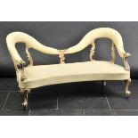 *Sofa. A Victorian sofa,  the curved upholstered back rail with gilt pine carved uprights, scroll