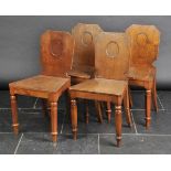 *Queen Victoria. A set of four Victorian hall chairs,  each with tapered back, solid seat on
