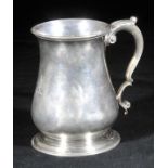 *Mug. A George II silver mug by Thomas Whipham, London 1750,  of baluster form, engraved with a