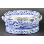 *Footbath. A Victorian blue and white twin handle pottery footbath,  printed with landscapes, 21cm