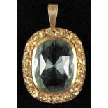 *Aquamarine. A Victorian aquamarine pendant,  set in a rocaille yellow metal mount with suspension