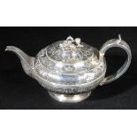 *Teapot. A George IV silver teapot by Joseph Angel I, London 1822,  profusely decorated with c-