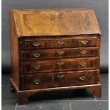 *Bureau. A George III walnut fall-front bureau,  the hinged fall enclosing drawers and inlaid
