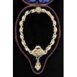 *Necklace. A fine Edwardian seed pearl necklace by Asprey & Company,  beautifully entwined with