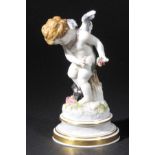 *Meissen. A porcelain figure of Cupid, late 19th century,  holding a small bouquet of flowers,