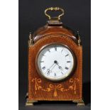 *Clock. An Edwardian inlaid mahogany mantel clock,  with circular white enamel dial, black roman