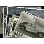 *Photographs. Twenty-two monochrome prints of motor racing scenes,  and a Freestone & Webb publicity