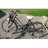 *A 1952 49cc Cairns 'MOCYC' Auxiliary Engine and Sunbeam Bicycle. Driving on the front wheel, this