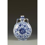 A CHINESE BLUE AND WHITE MOON FLASK, each side decorated with a central spiral motif surrounded by