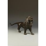 A JAPANESE BRONZE FIGURE OF A MALE LION, the animal striding forward and with its head raised and