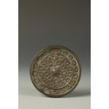 A JAPANESE CAST BRONZE CIRCULAR MIRROR decorated in relief with chrysanthemum flowers surrounding