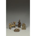 FOUR SMALL INDIAN BRONZE FIGURES including a standing devi, 4.75" high; a shrine group with two