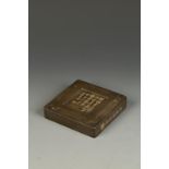 A CHINESE INSCRIBED SQUARE INKSTONE, the top surface with a poetic inscription signed Wu Changshuo