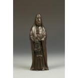 A JAPANESE BRONZE FIGURE OF GYORAN KANNON, the deity wearing a long robe and carrying a basket,