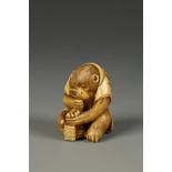 A JAPANESE IVORY MONKEY NETSUKE, the seated animal holding a magnifying glass, signed Masamitsu,